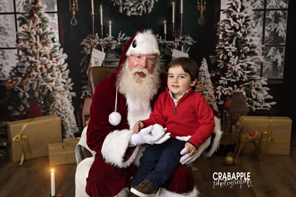 Young boy sits on Santa's lap during holiday mini session north of Boston