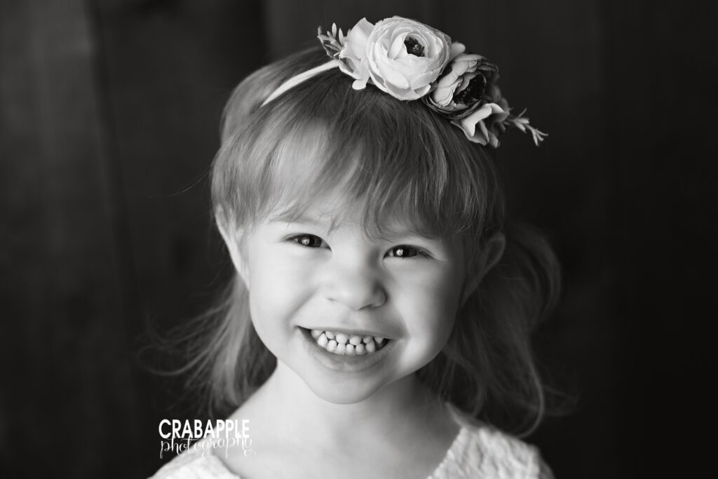 Black and white toddler girl portrait with gentle studio light
