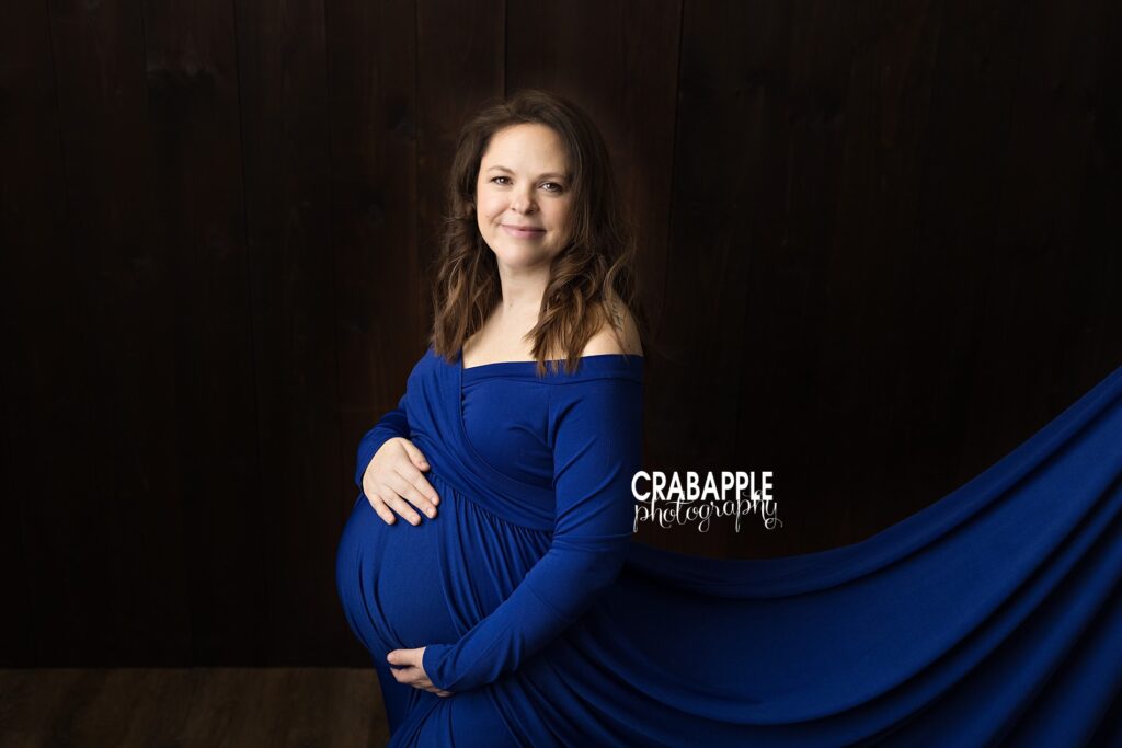 Color maternity portrait of expectant mother in natural light
