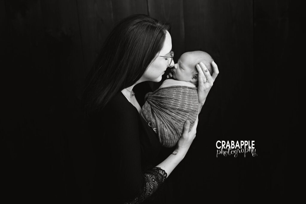 Connection-Focused Newborn Baby Photoshoot Mother and newborn baby sharing a quiet moment during a newborn baby photoshoot