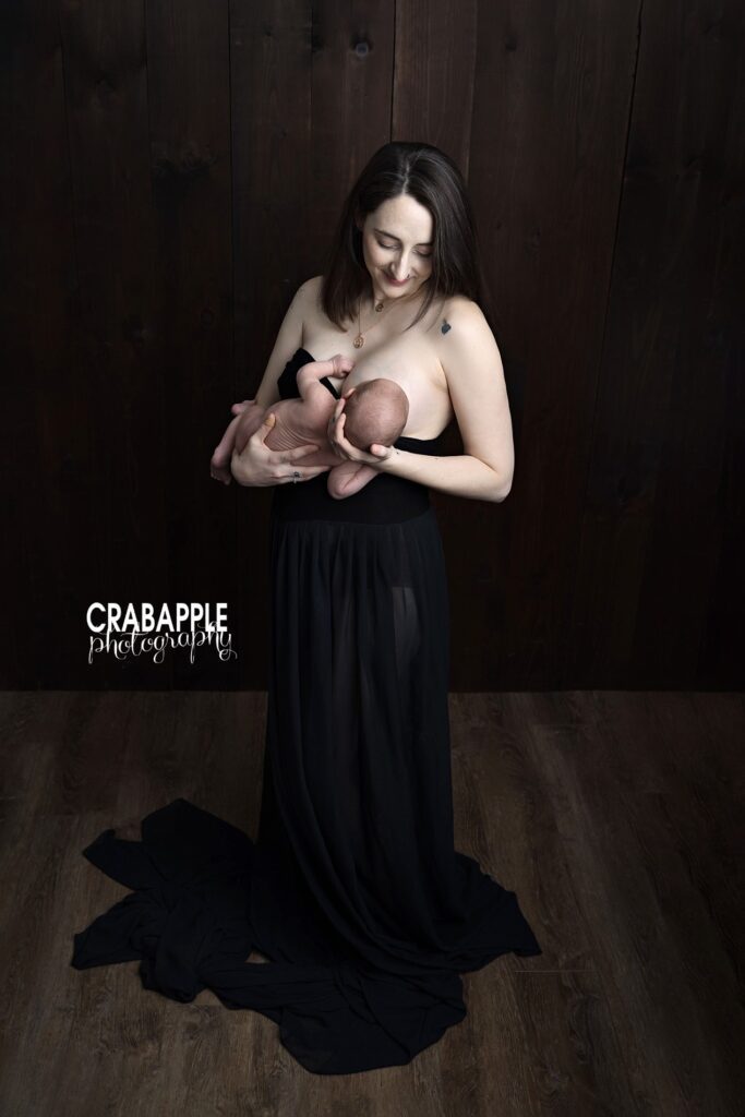 Natural breastfeeding newborn baby photoshoot Intimate breastfeeding moment captured during a newborn baby photoshoot in Andover MA