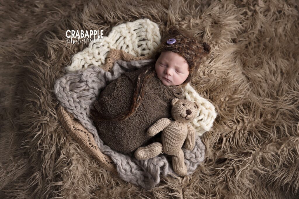Newborn Baby Photoshoot with Teddy Bear Newborn baby photographed with teddy bear during a newborn baby photoshoot