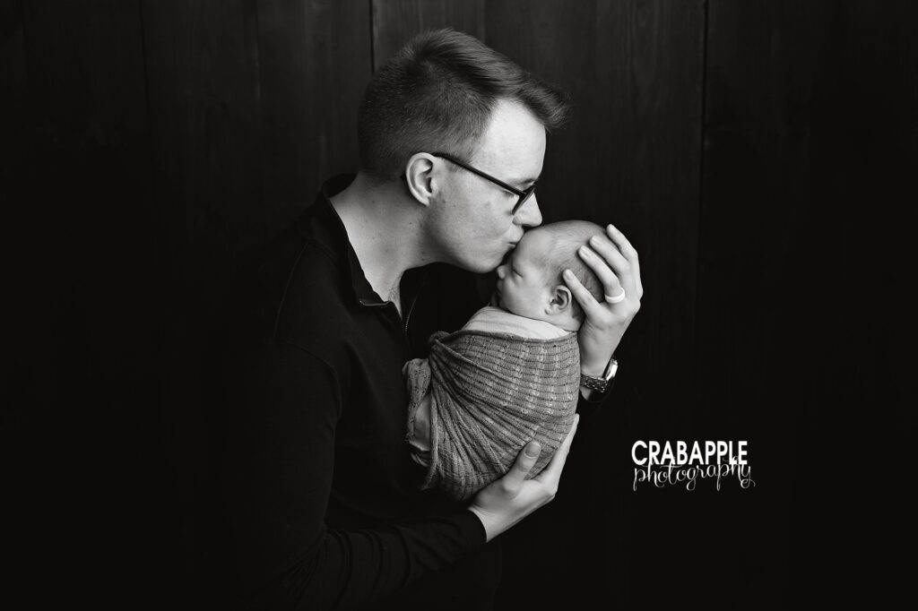 Father and Newborn Baby Photoshoot in Studio Emotional father and newborn son portrait from a newborn baby photoshoot in Andover MA