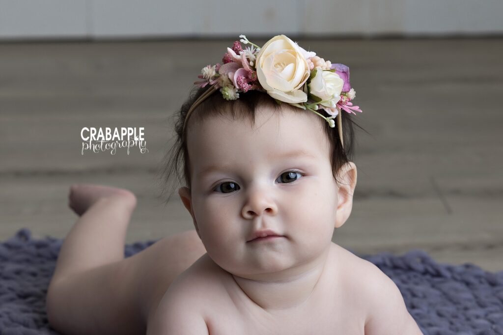 Natural baby girl pictures featuring expressive eyes and soft details in a Newton MA studio
