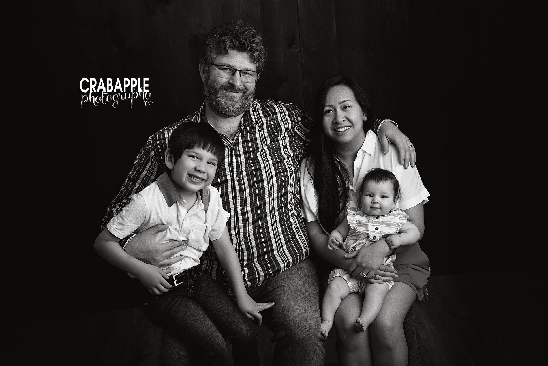 Black and white family portraits with two children near Boston