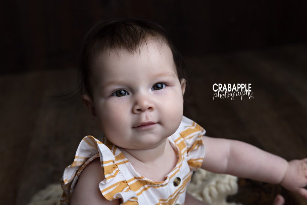 Close up baby girl pictures captured in a Newton MA photography studio with a timeless feel

