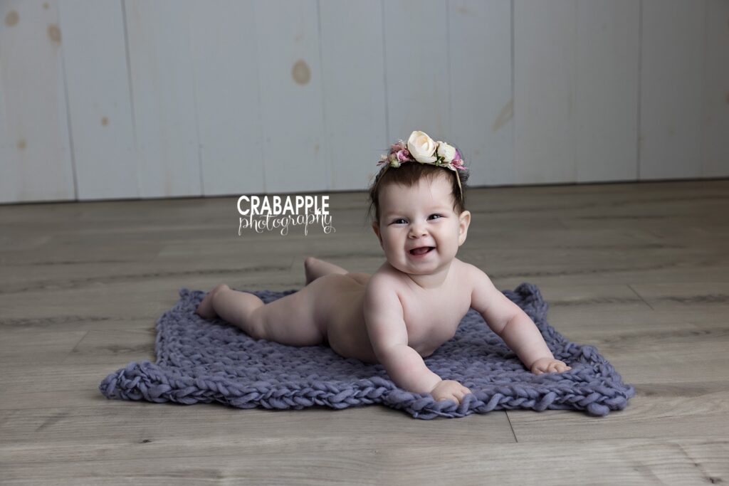 Baby girl pictures taken on a studio floor setup with natural light in Newton MA
