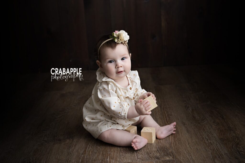 Timeless baby girl pictures using neutral tones in a Newton MA photography studio

