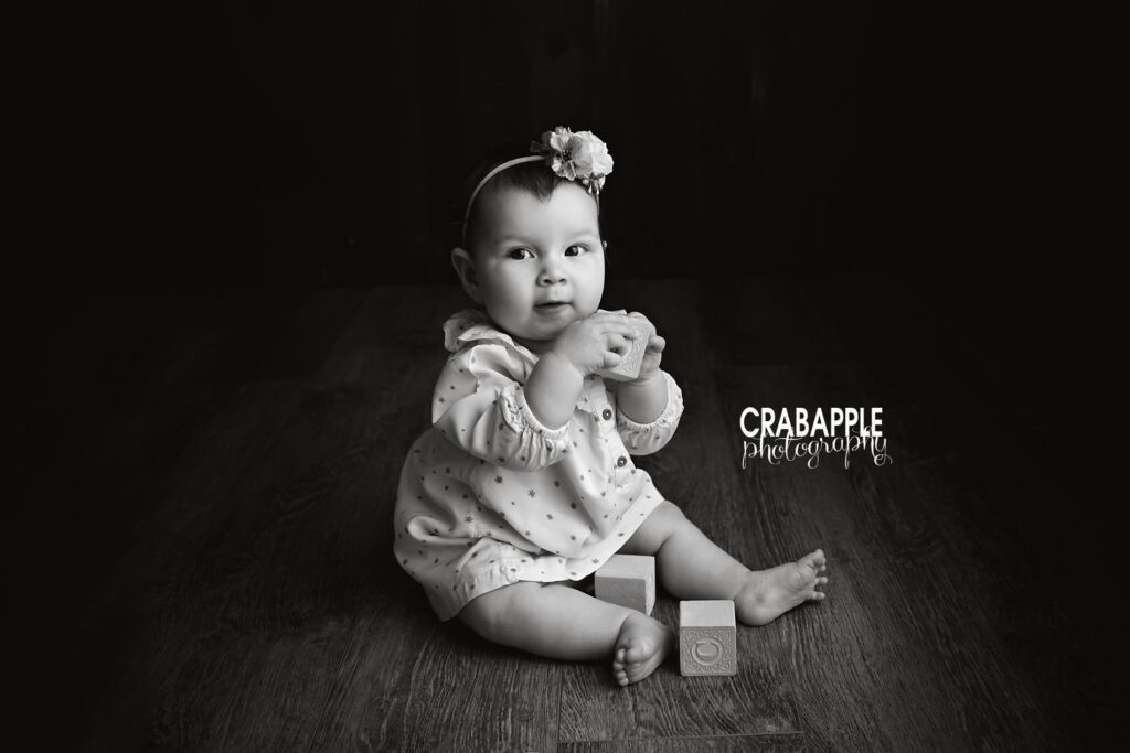 Classic baby girl pictures photographed in a Newton MA studio with soft timeless styling
