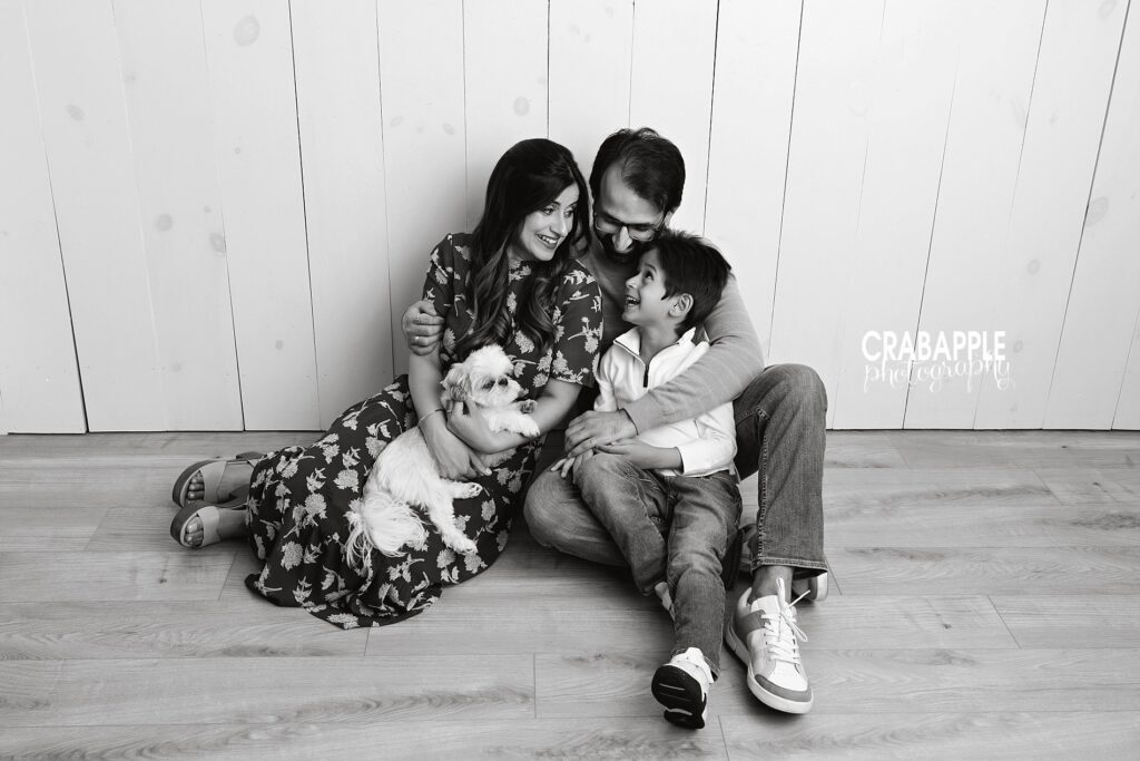 Black and white family portrait with parents child and dog during family photos in Reading MA
