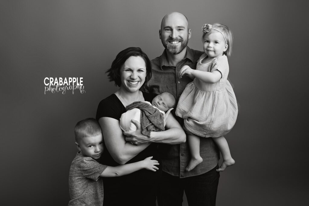 Black and white family photos with newborn in Littleton MA