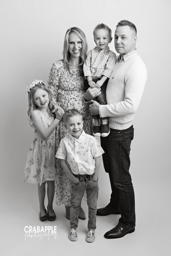 Black and white Boston maternity photos by a family maternity photographer featuring parents and children
