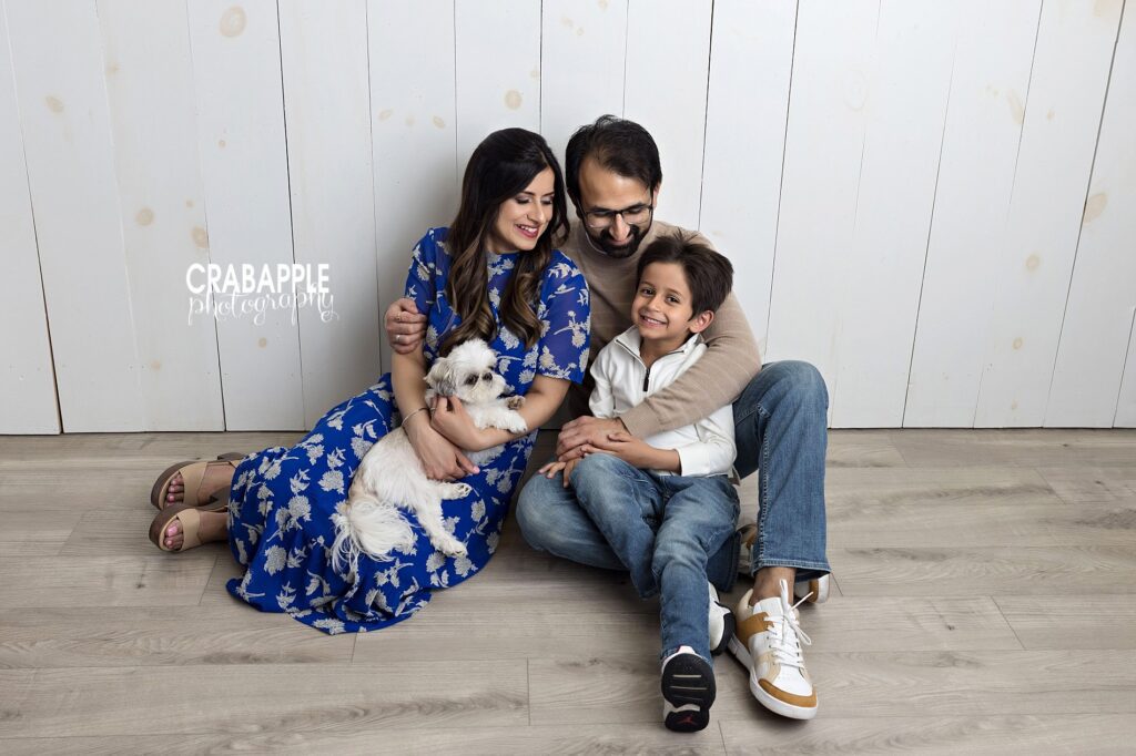 Candid moment of family laughing together during family photos in Reading MA
