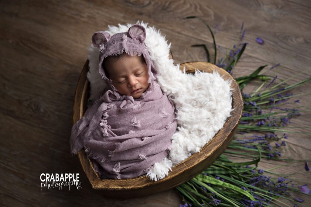 Floral newborn photo ideas Using purple, floral, and greenery in newborn photos