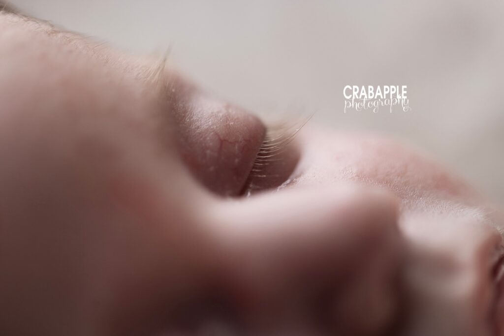 Close up of eyelashes and details during newborn portrait session