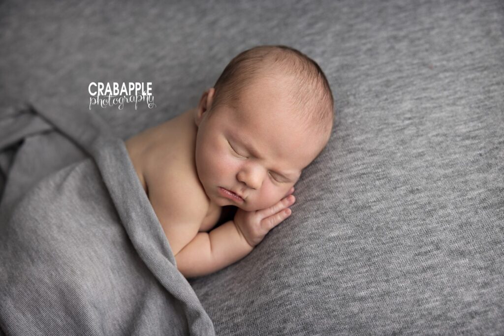 Classic newborn pictures featuring a softly posed baby in Littleton MA
