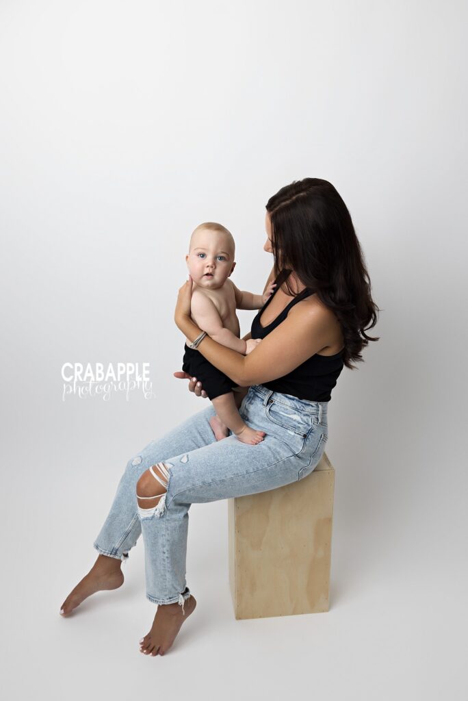 Mother and baby sharing connection during studio photoshoot
