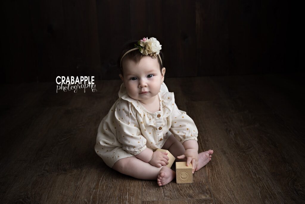 Six month baby girl pictures captured in a Newton MA studio with a timeless and natural style
