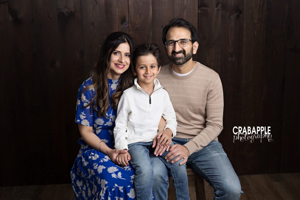 Parents sharing a quiet moment during emotional family photos in Reading MA
