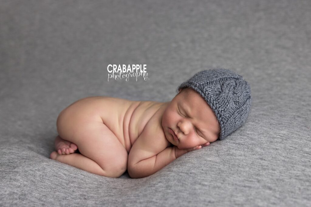 Timeless newborn pictures on a textured neutral backdrop in Littleton MA
