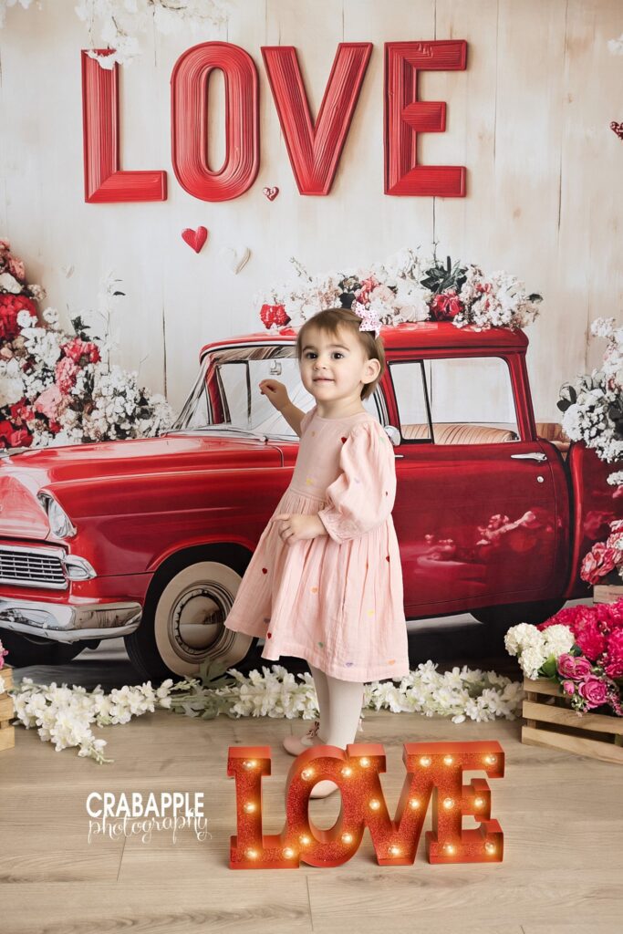 Two year old birthday portrait with Valentine’s Day styling photographed in studio

