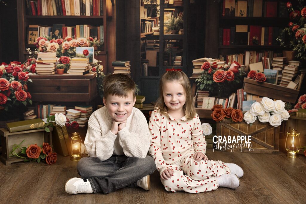 Brother and sisters sitting together during a Valentine’s Day photography session