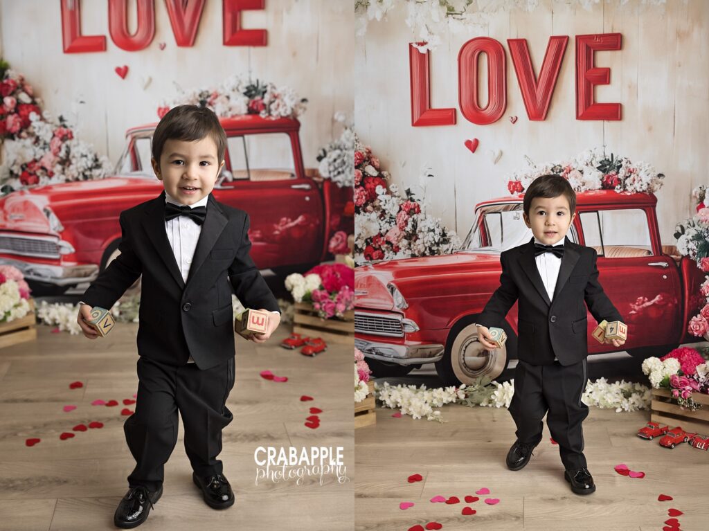 Child portrait in front of red truck backdrop during Valentine mini photo session
