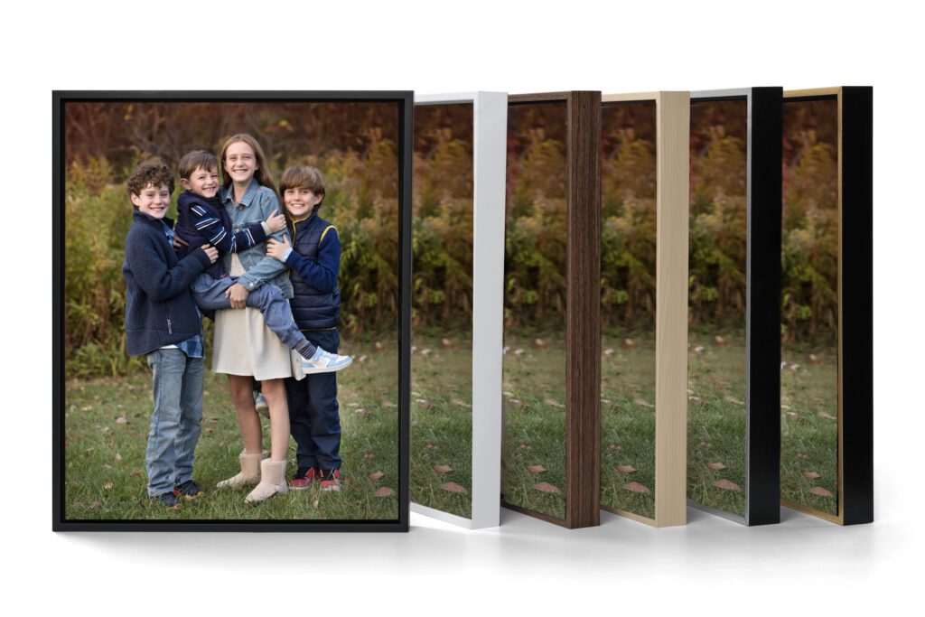 Four siblings smile outdoors for family portraits as examples of different frame colors