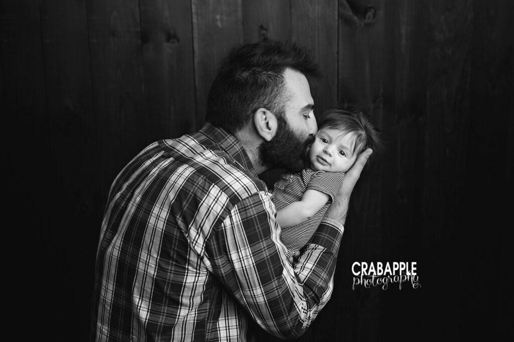 Father cuddling his baby during a 3 month baby photoshoot in Dracut MA
