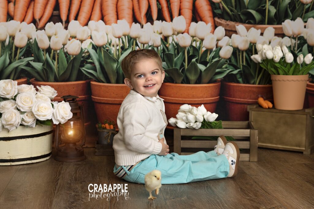 young child smiling during spring easter photo session near boston
