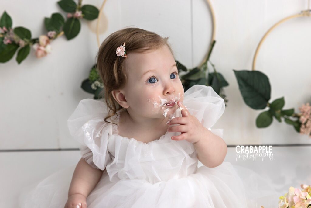 side profile of baby girl with cake smash setup