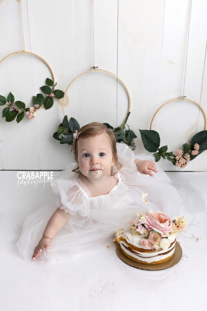 simple floral baby girl cake smash idea
