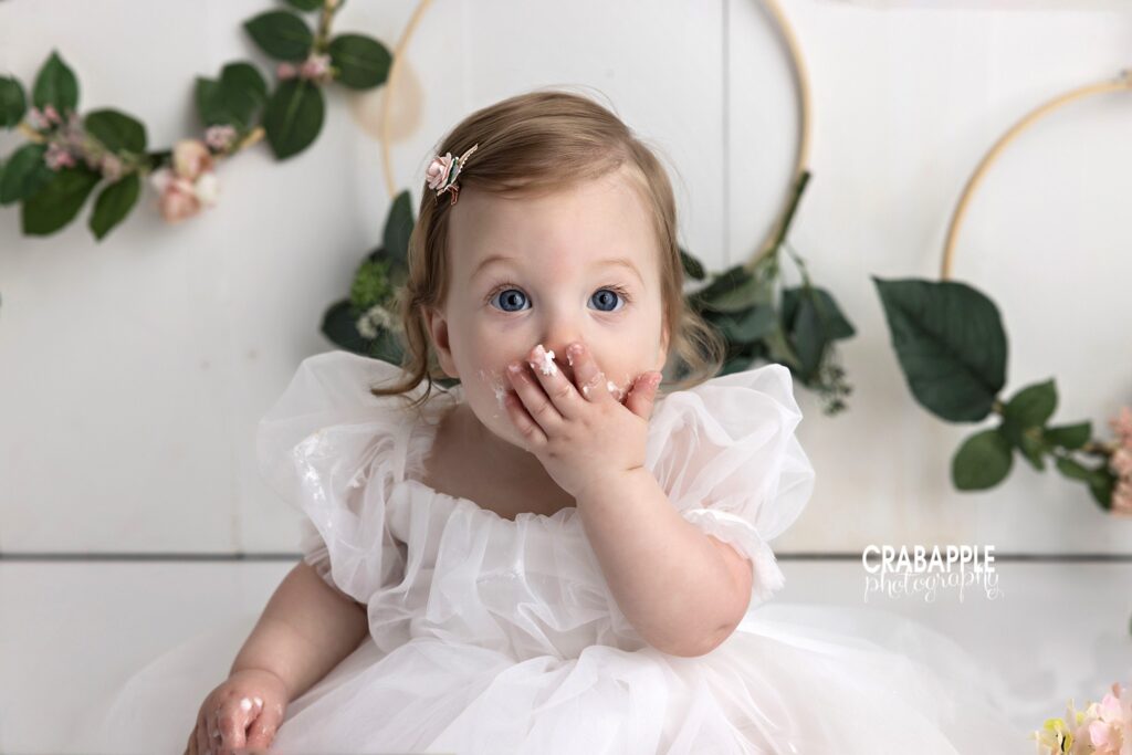 closeup of baby girl during cake smash
