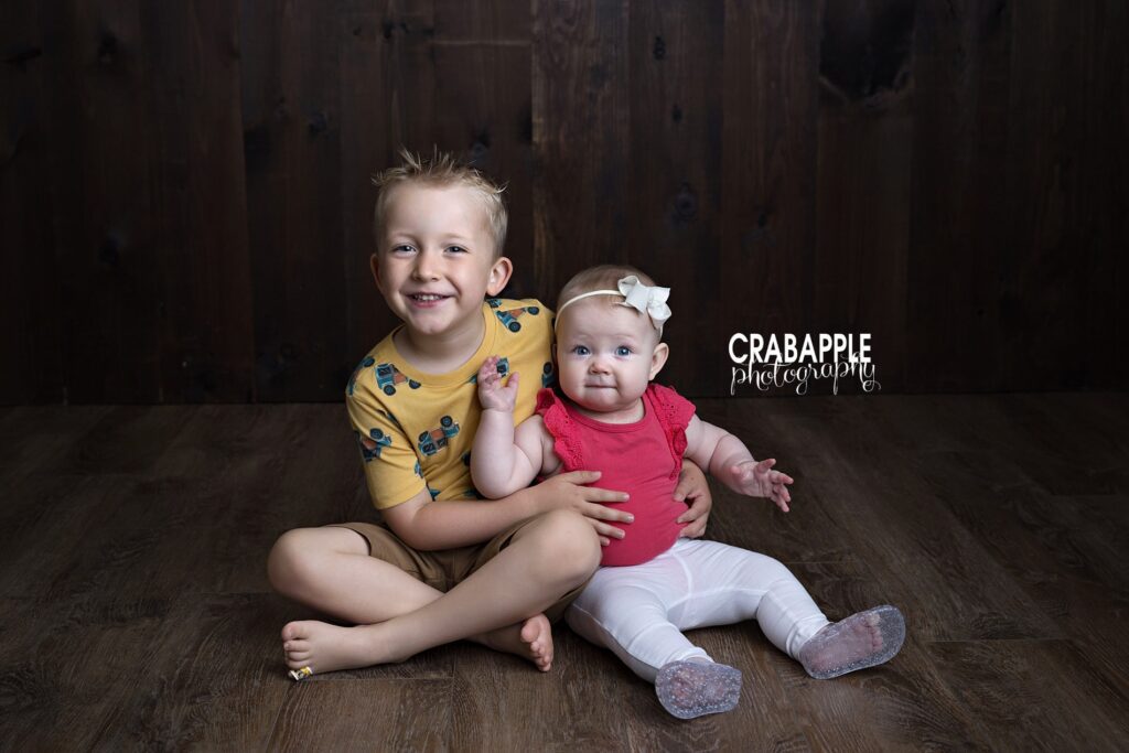 sibling connection baby portrait photography session baby and toddler siblings sitting together baby portrait photography Bedford MA