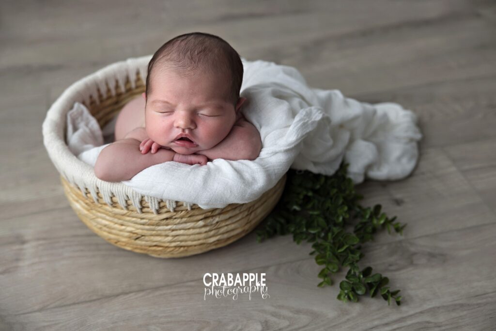 newborn photo ideas baby girl in woven basket with natural textures North Andover MA

