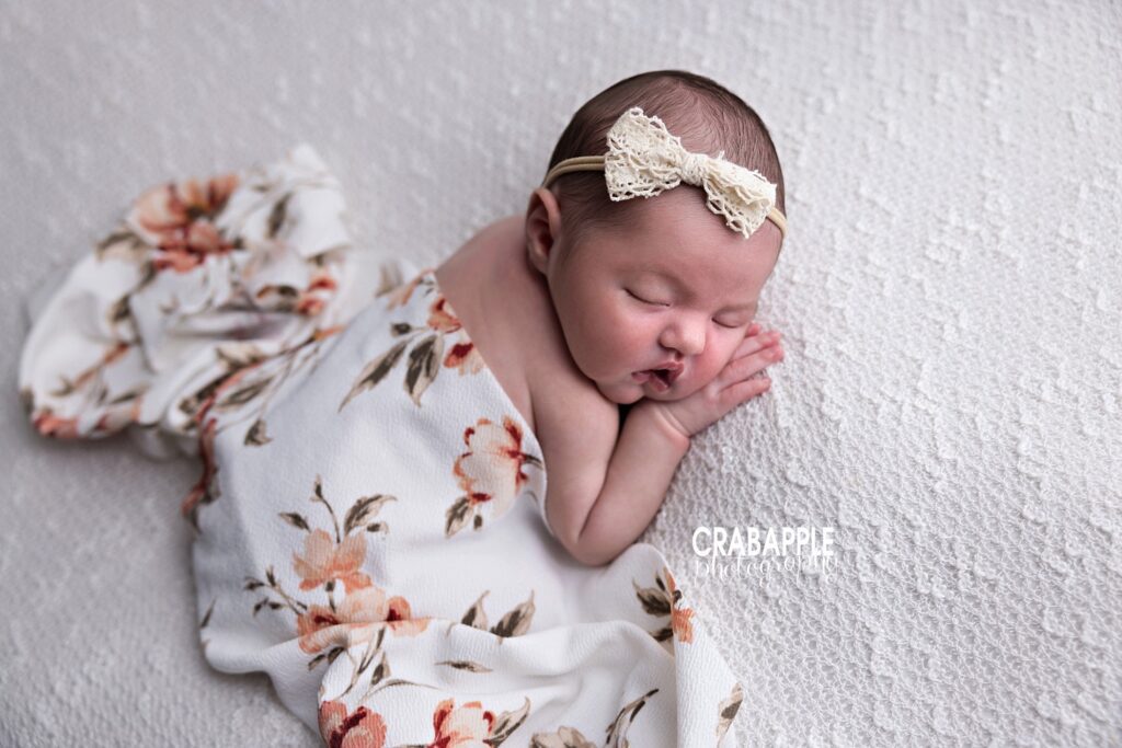 newborn photo ideas baby girl with floral blanket natural light newborn photography
