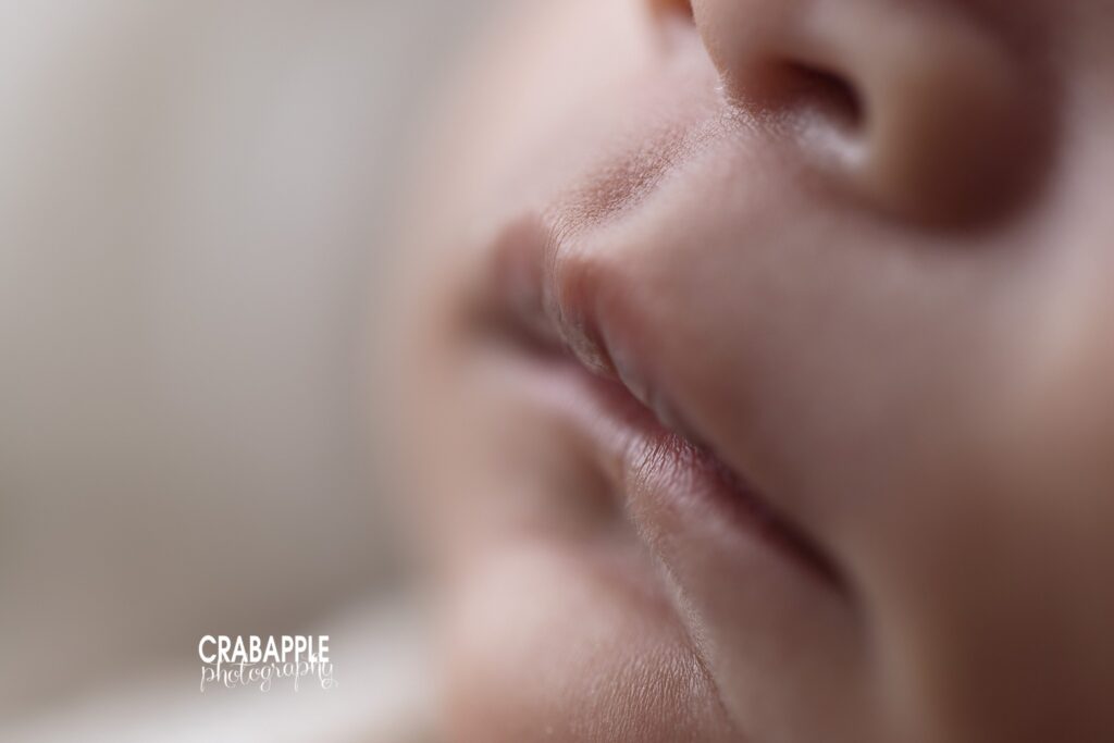 close up of newborn mouth and face detail
