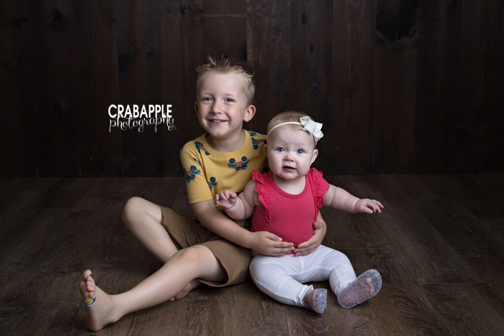 Bedford MA baby portrait photography siblings milestone session siblings sitting together during baby portrait photography session in Bedford MA