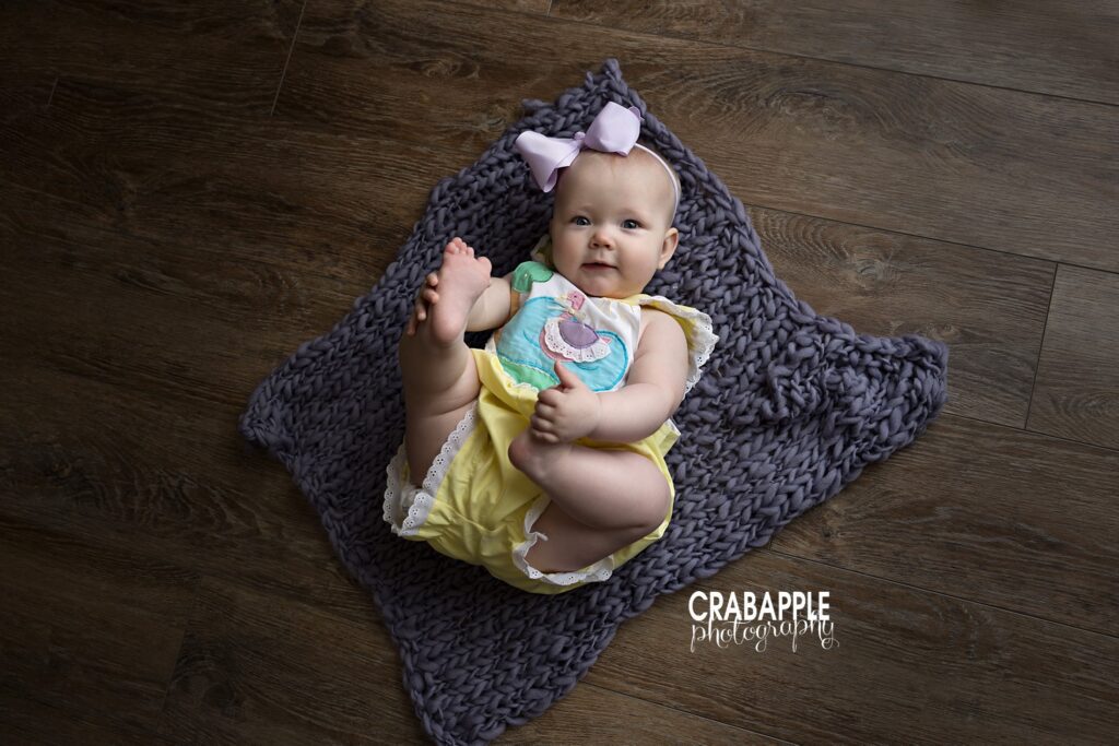 8 month old baby portraits 8 month old baby girl photo lying on floor bedford, ma