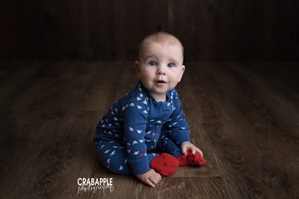 Baby boy blue outfit baby boy sitting and smiling in blue outfit during 9 month photoshoot Andover MA