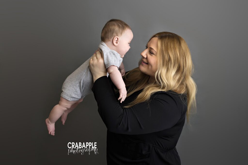 Candid mother and son moment during sitter session photoshoot