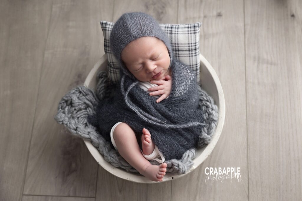 professionally posed newborn professionally posed newborn in wooden bowl