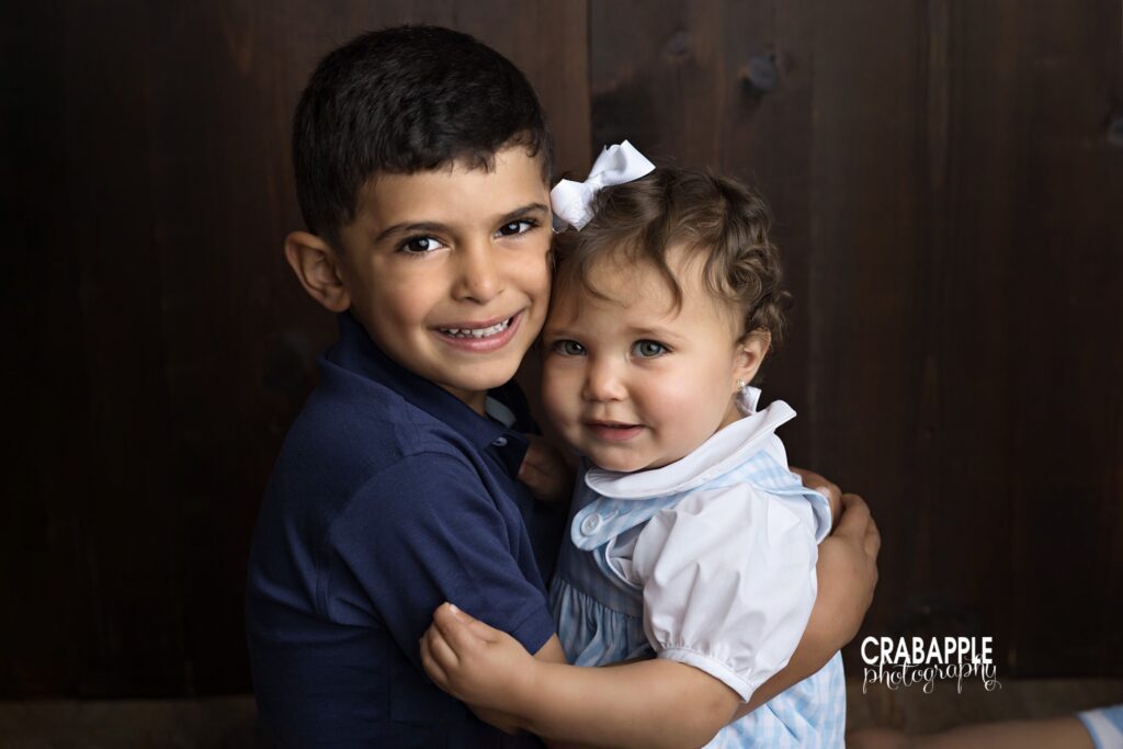 sweet brother and sister photo during milestone baby session by Southborough baby photographer