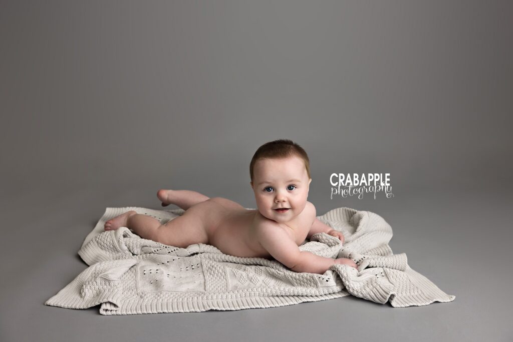 Baby smiling doing tummy time sitter session baby photography