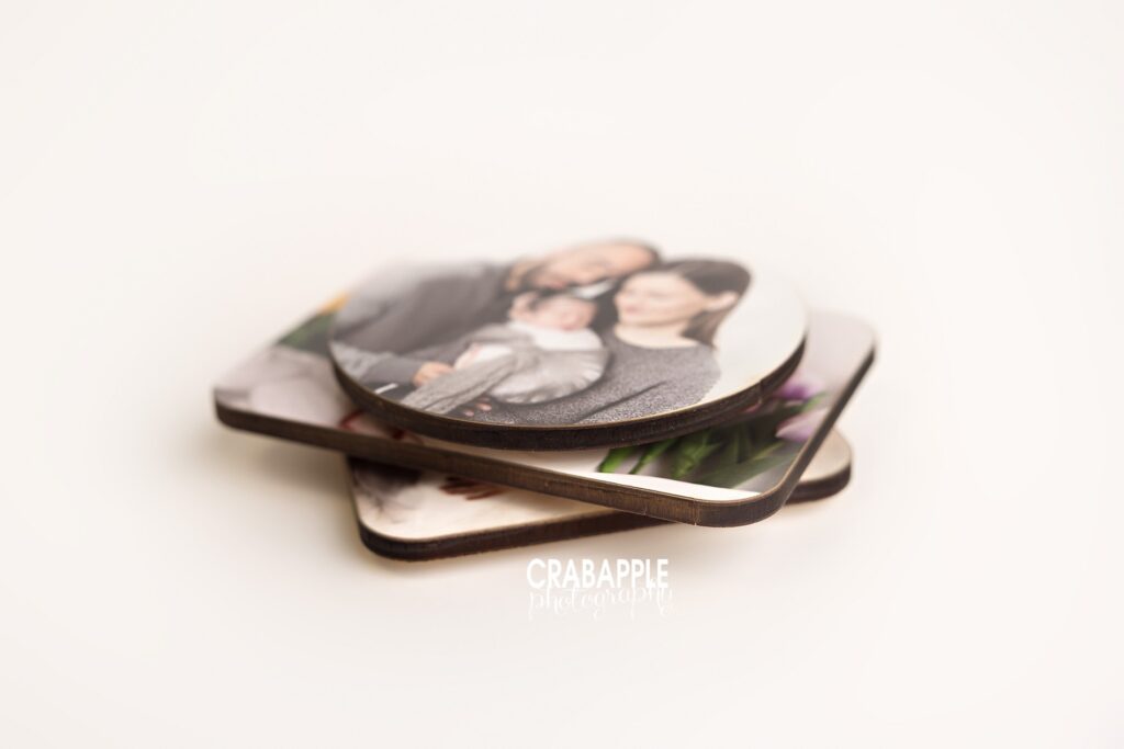 A stack of various shaped wooden photo magnets