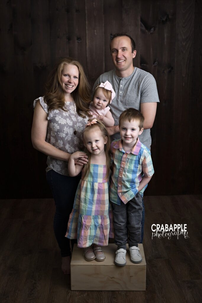 Full family standing together during milestone photography session
