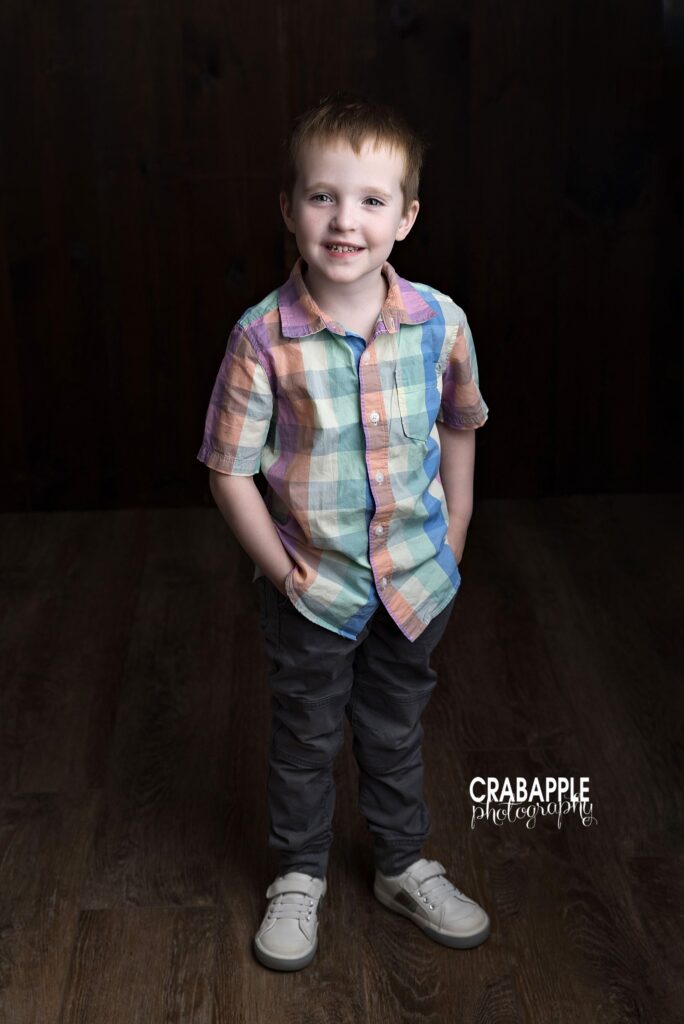 Full body portrait of older brother during family milestone session
