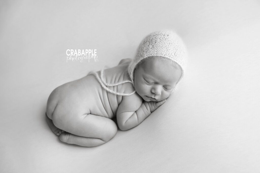 Newborn Portrait in Black and White Black and white photo of classic tummy lying newborn photography pose