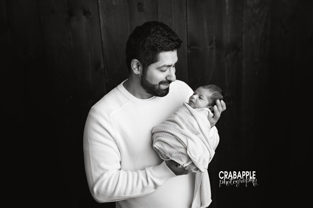 Dad and Baby Portrait Black and white portrait of father holding newborn daughter