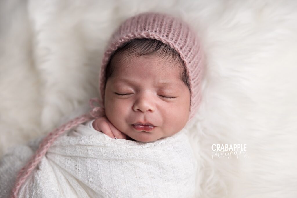 Pink Bonnet Close Up Close up newborn portrait with pink bonnet and white swaddle